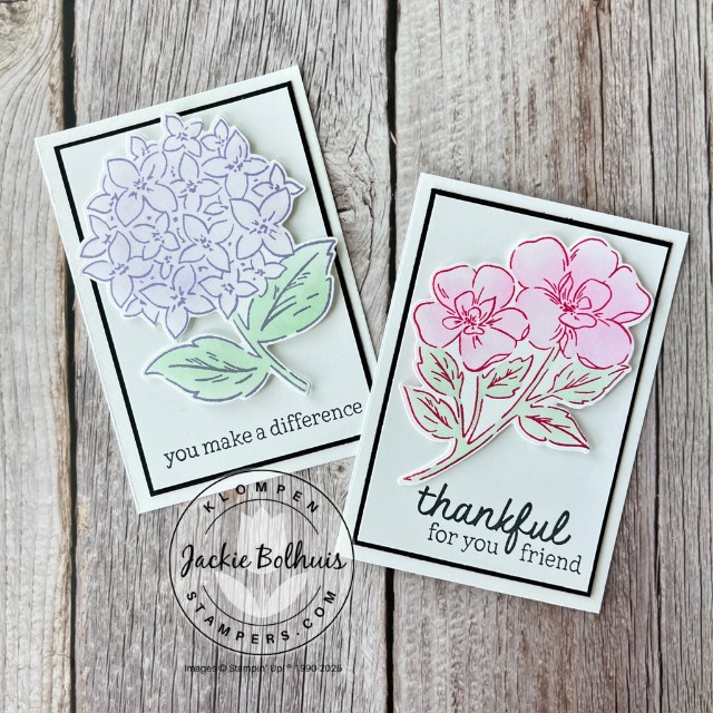 Two simple handmade cards with a large floral image an a stamped sentiment. One card has a purple flower and the other has a pink flower.