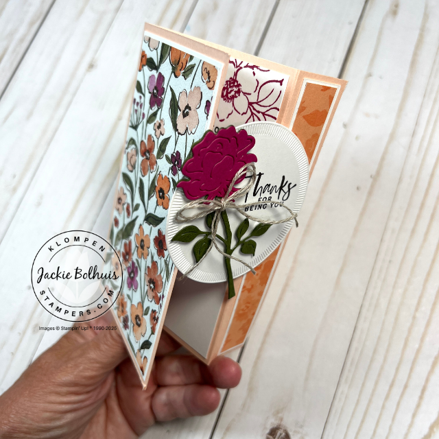 Side view of an easy fun fold card showing the back fold design with colorful stamped images and elegant die cuts.

