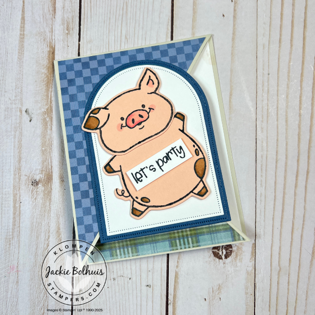 Close-up of piggy-themed fun fold card with playful coloring and die-cut details.