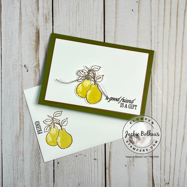 Close-up of a stamped card with a bold pear from Stampin’ Up!’s Perfectly Pears set, accented with a simple linen thread bow on a note card.