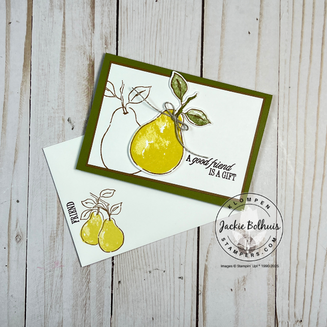 Close-up of a stamped card with a bold pear from Stampin’ Up!’s Perfectly Pears set, accented with a simple linen thread bow on a note card.