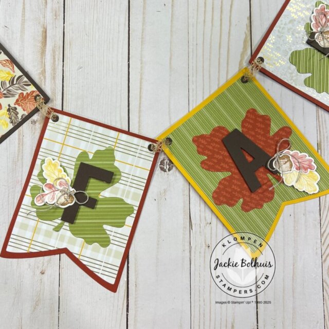 Paper crafting project featuring a handmade banner design with seasonal colors.