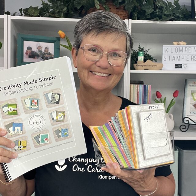 Jackie Bolhuis holding her Creativity Made Simple Card Template Book filled with easy card making designs.