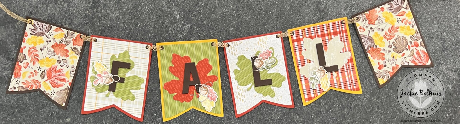 Close-up of handmade banner pieces showing die-cut letters and colorful paper.