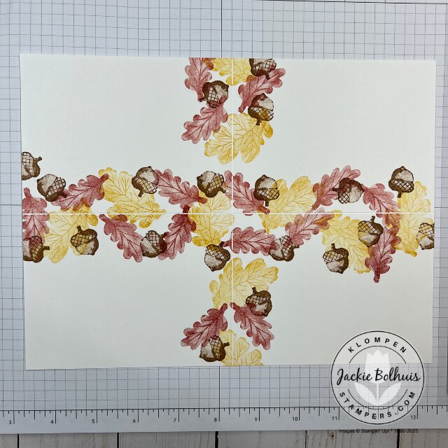 Close-up of stamping detail from the Gathering Moments stamp set showing layered colors and textures on the background sheet.