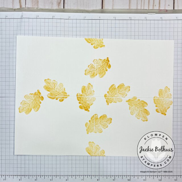 Step one of stamping the One Sheet Wonder background using images from the Gathering Moments stamp set in fall colors.