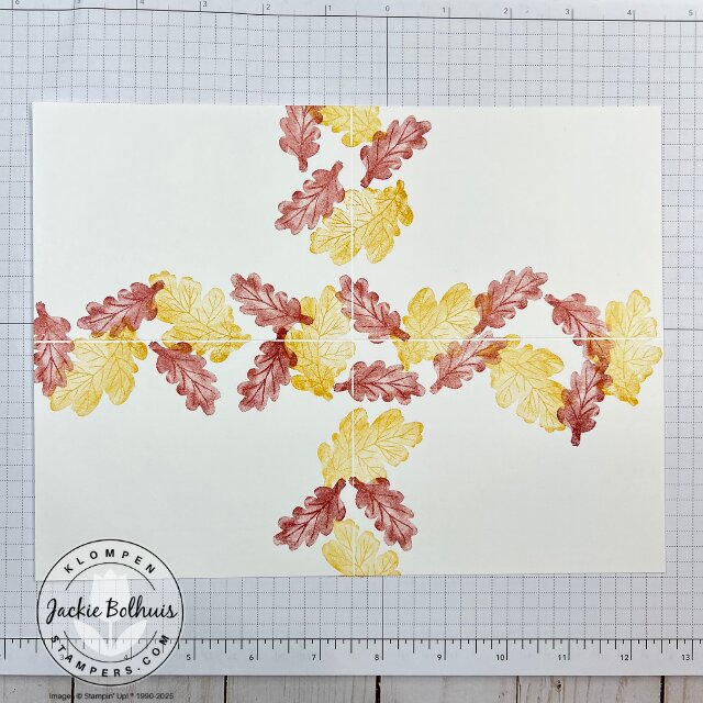 Adding stamped leaves and branches to the blank sheet to build the fall background for the One Sheet Wonder cards.