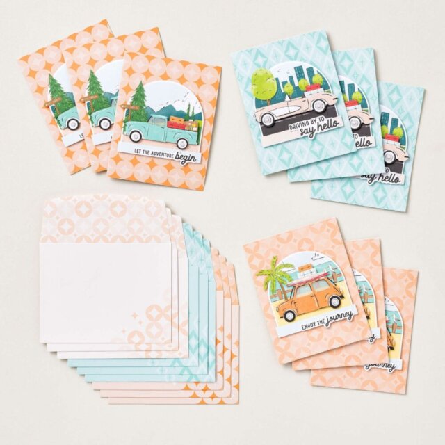 Three completed Adventure Awaits Kit cards showing travel-themed designs with cars, outdoor landscapes, and printed sentiments. 