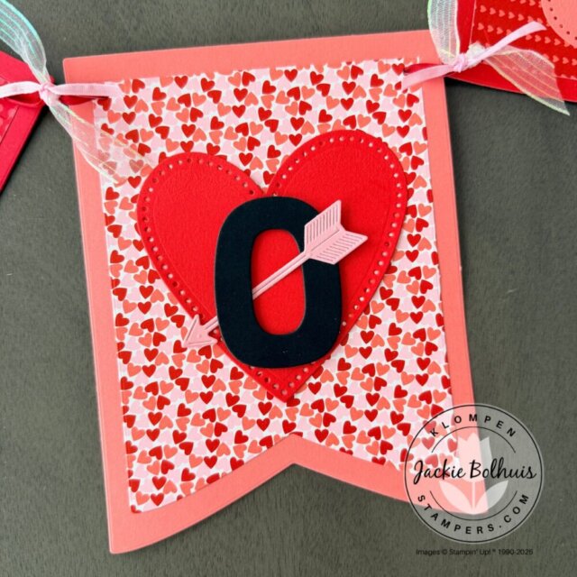 Valentine’s Day banner close-up showing paper layering and decorative embellishments.