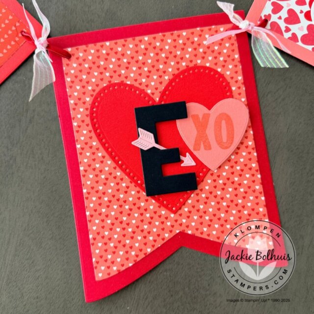 Close-up of a DIY Valentine’s Day banner panel with hearts and coordinating cardstock.