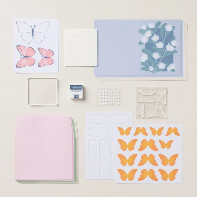 Butterfly Garden kit supplies laid out with card bases, envelopes, and embellishments