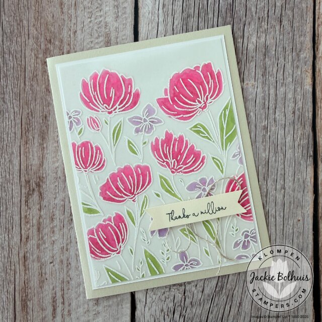 Elegant handmade card with a vellum overlay, embossed floral image, and blended coloring that highlights this easy and simple card making technique.